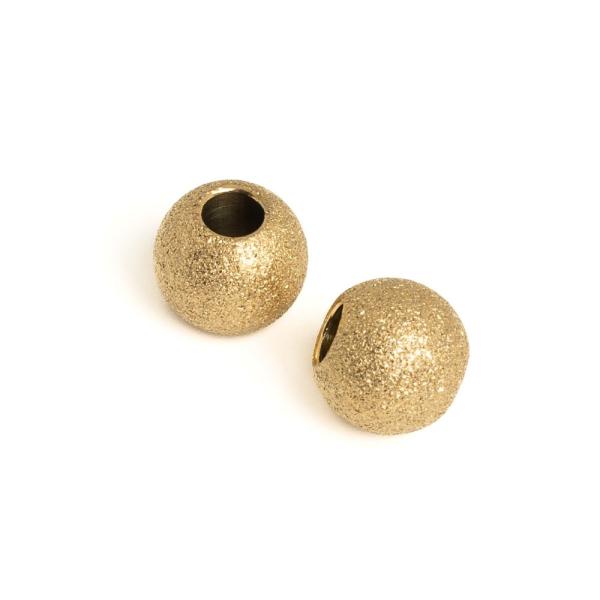 Homokf�vott hat�s� gy�ngy 8x6 mm arany nemesac�l 2 db (ion plating)