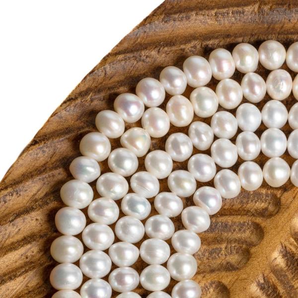 Teny�sztett gy�ngy�k 7 x 5,5mm zsin�r