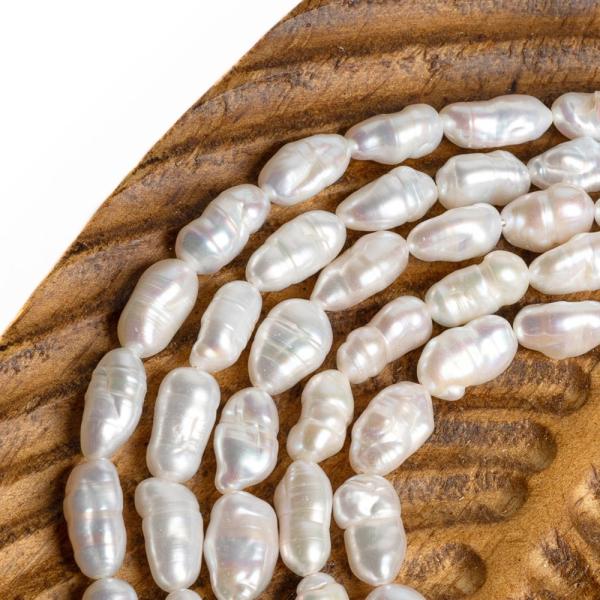 Teny�sztett gy�ngy�k 6x11,5 mm hossz�k�s nyers zsin�r
