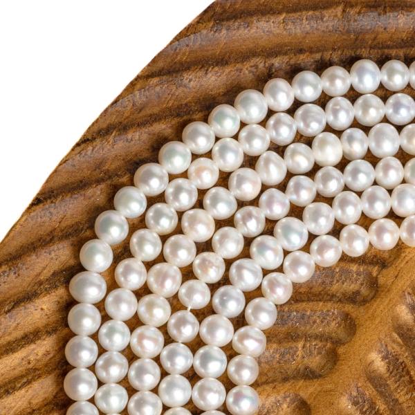 Teny�sztett gy�ngy�k 5-5,5 mm zsin�r
