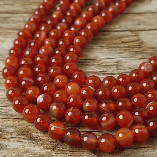 goralky-z-kamena-sardonyx-oranzove-leskle-hladke-nebrusene-6mm-oranzovobiele-na-naramky